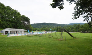 Adjacent Pool and Swing Set